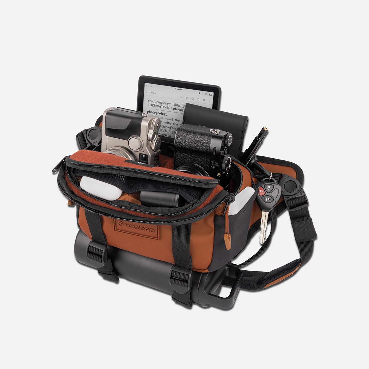 WANDRD ROGUE Sling 4L V2 in Sedona Orange, packed out with gear