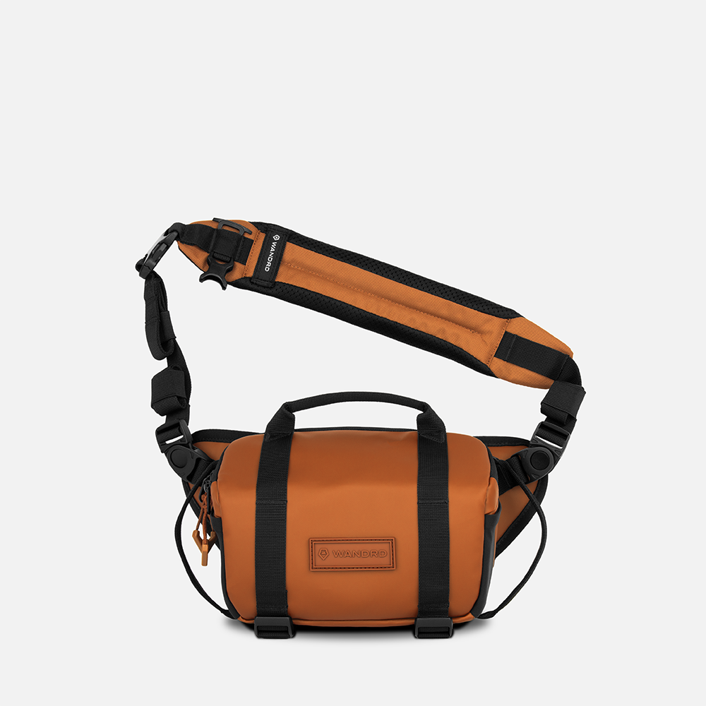 WANDRD ROGUE Sling 4L V2 in Sedona Orange, front view with strap