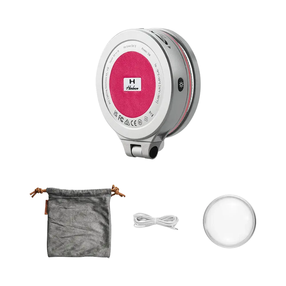 Harlowe Sol 5 XM Bi-Color Mobile Light with silver body, magenta center logo, grey pouch, white cable, and diffuser.
