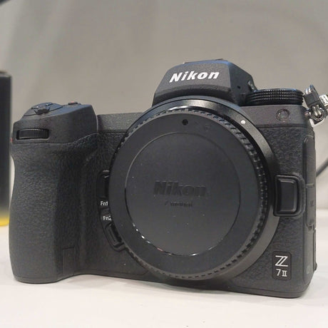 Nikon Z7 II camera on a white surface with a blurred background