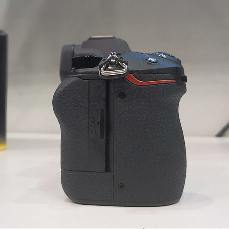 Camera body on a white surface with a 'Z 7 II' branded box in the background