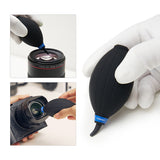 VSGO DKL-20 air blower being used to clear dust from a lens and camera