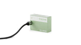 Tilta TNP-W126S battery in Ash Green charging with a USB-C cable plugged into its input port