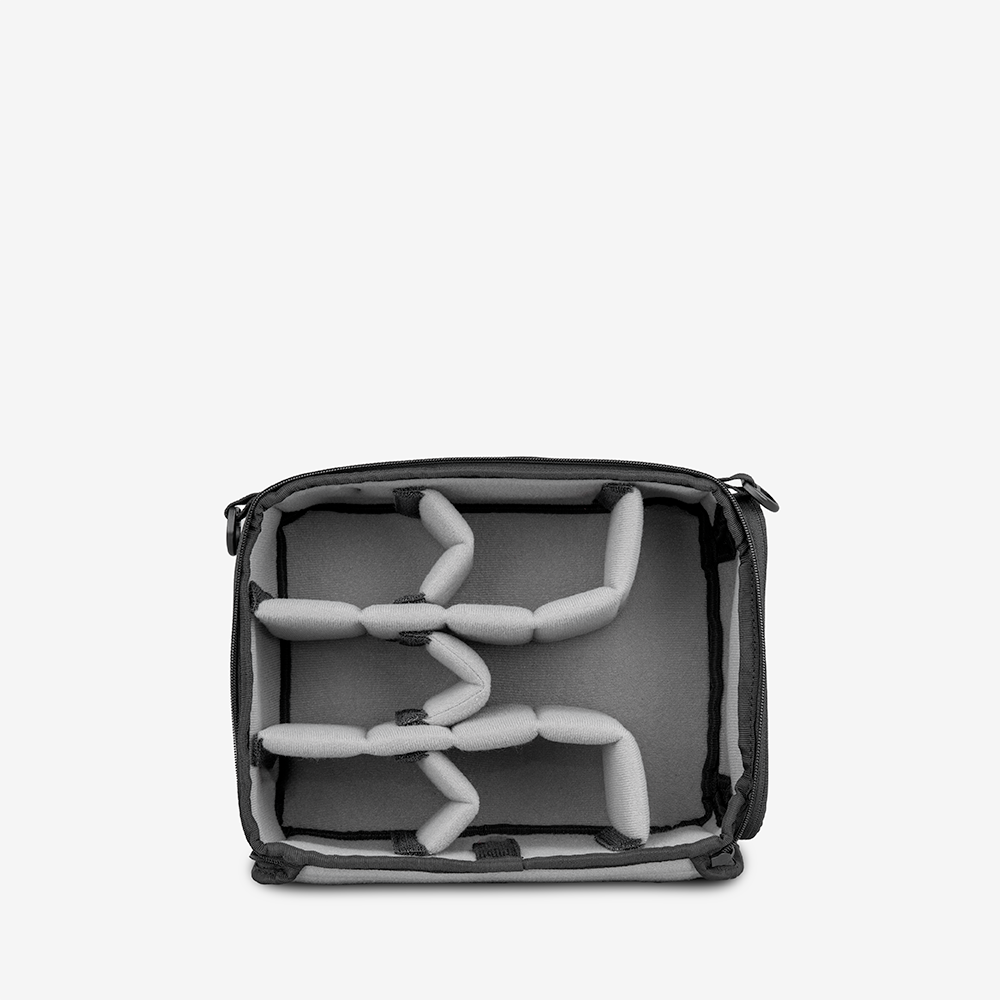 WANDRD Essential Camera Cube V2 open, showing padded interior and dividers