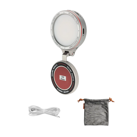 Harlowe Sol 5 Bi-Color Mobile Light, silver, hinged design with red center and logo, includes USB-C cable and gray pouch.