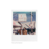 Sample photo shot on Polaroid Color 600 Film — couple outside an ice cream stand