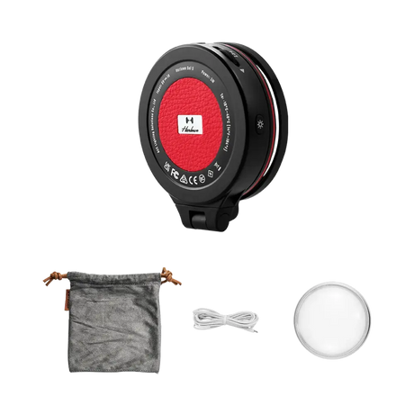 Harlowe Sol 5 XM light: black casing, red center, white illuminated face, pouch & cable. All components.